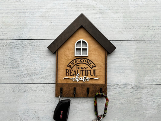Laser Cut “Welcome to Our Beautiful Chaos” Key Holder – Wooden House Wall Decor